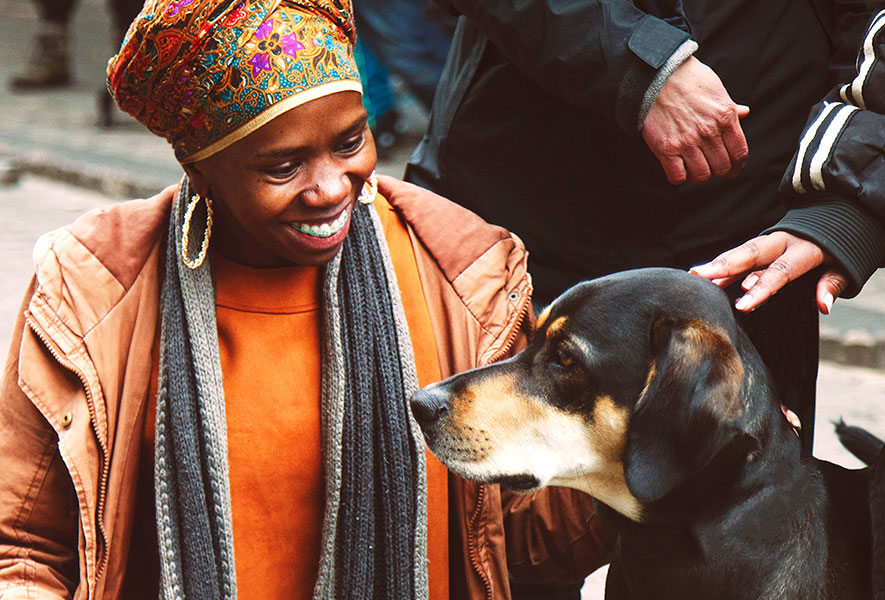 Happy African woman and dog