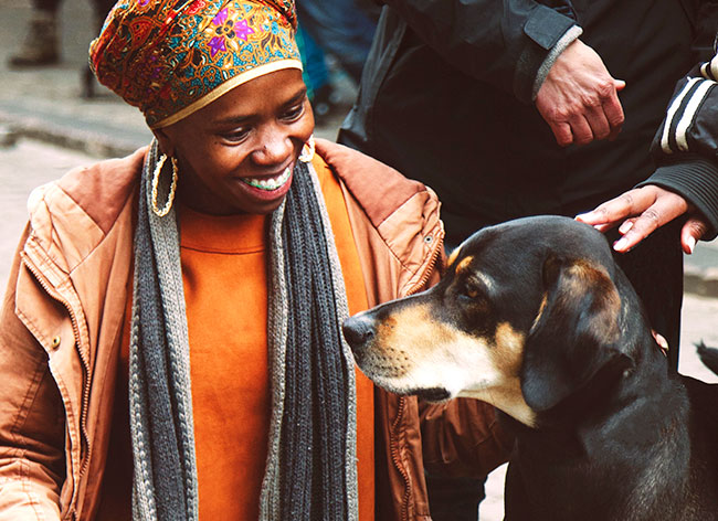 Happy African woman and dog