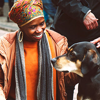 Happy African woman and dog