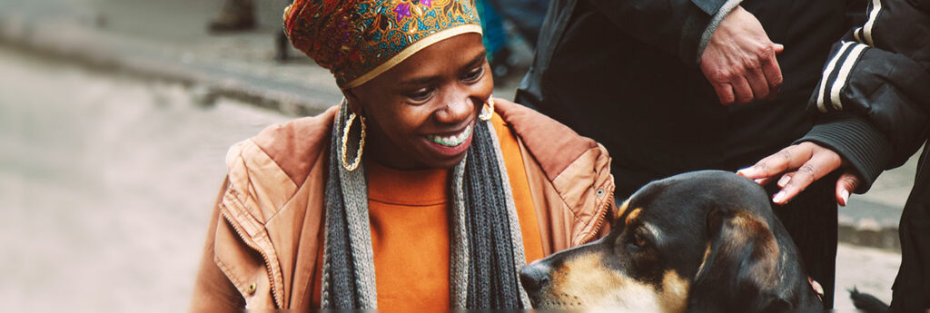 Happy African woman and dog