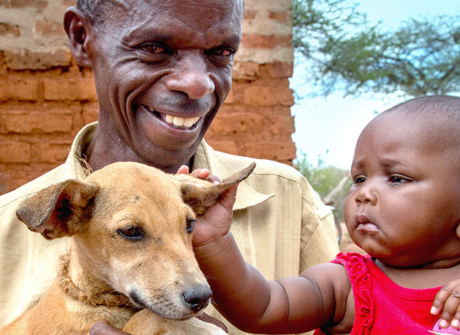 African family and dog